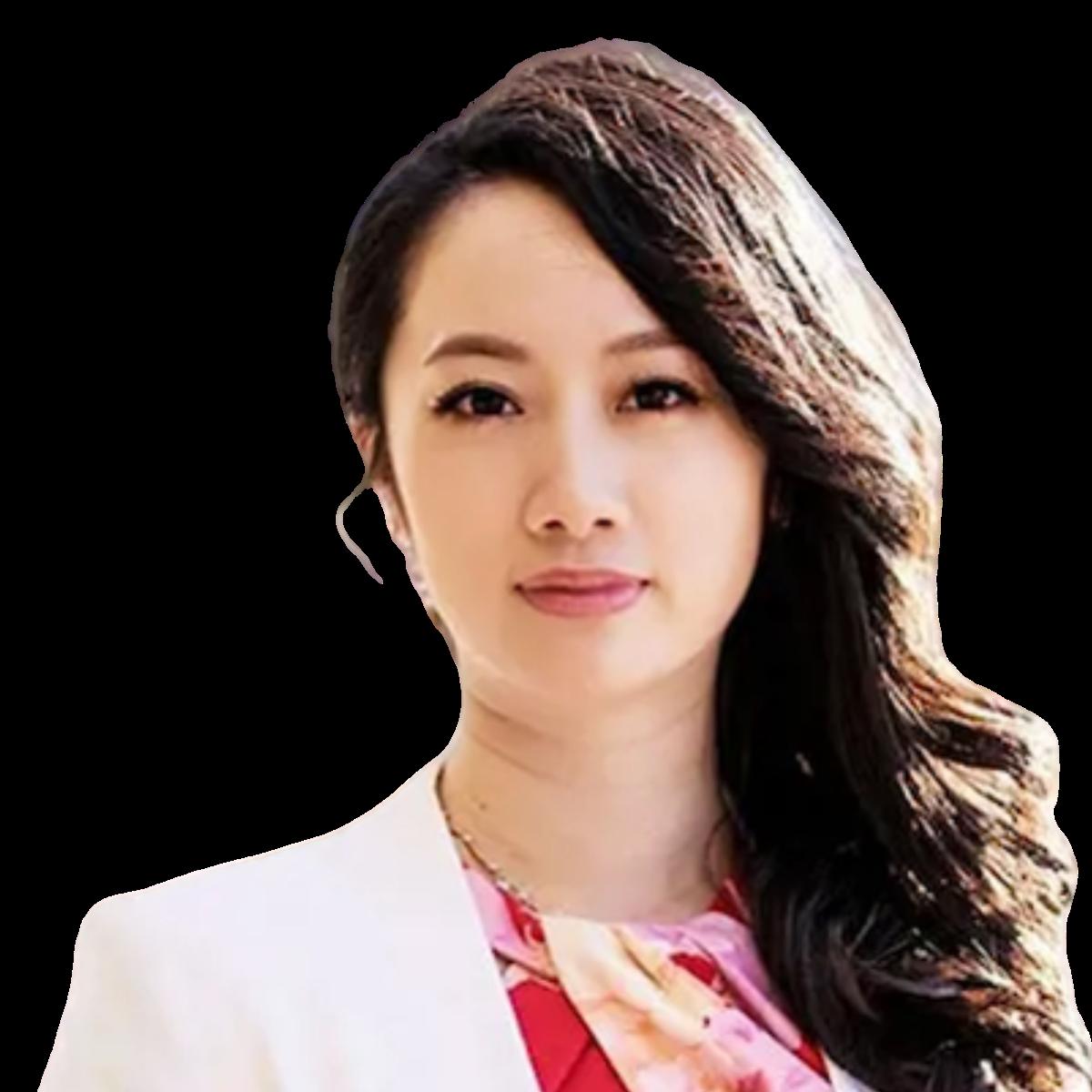 Professional headshot of a female doctor in a white blazer and pink blouse