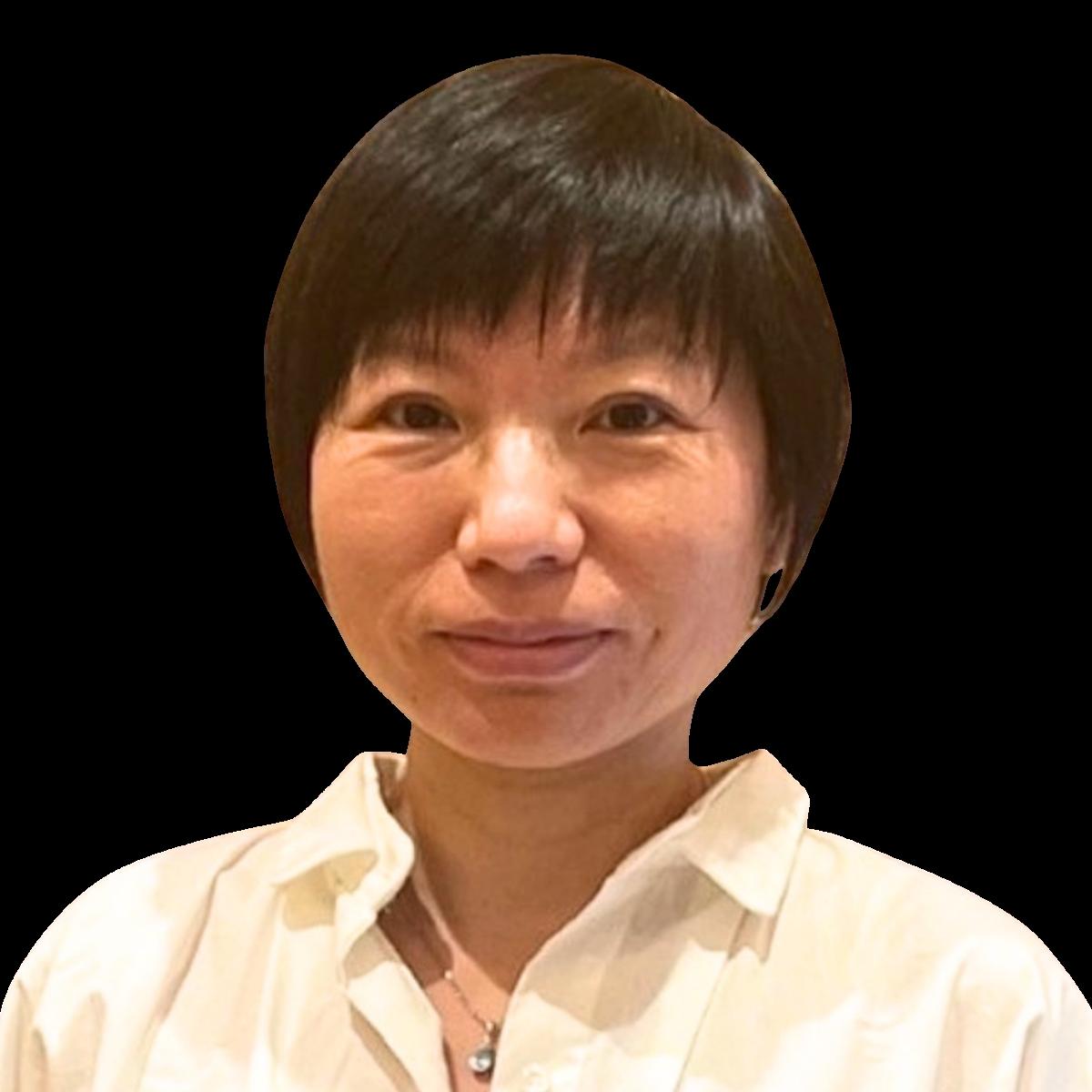 Professional headshot of a female doctor in a white blouse smiling at the camera