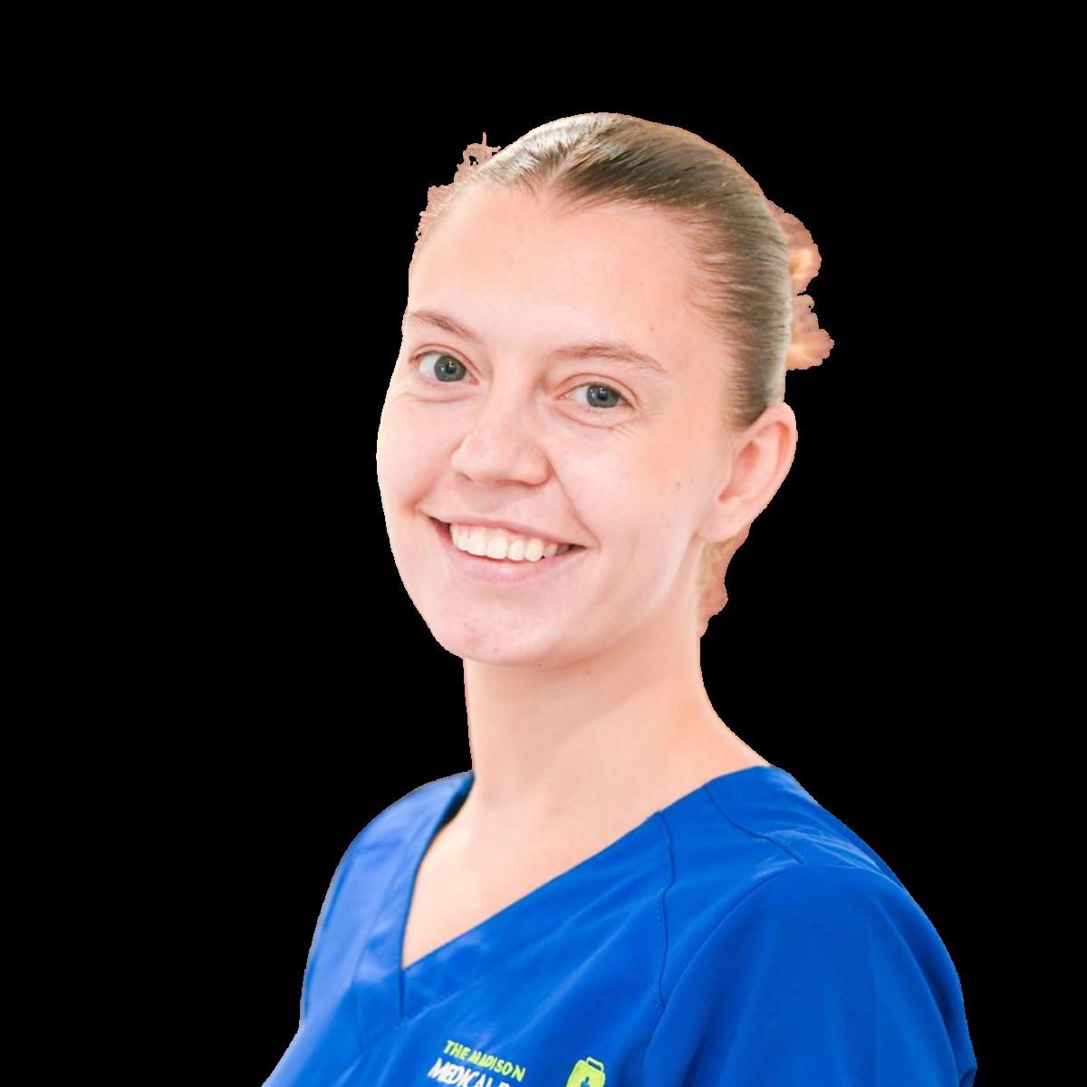 Smiling nurse in blue medical scrubs, professional headshot