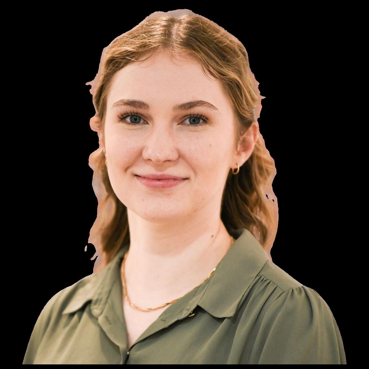 Professional headshot of a female healthcare team member in a green blouse