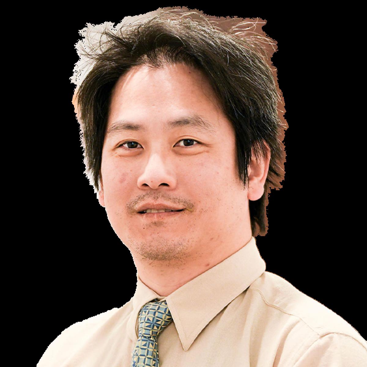 Professional headshot of male healthcare practitioner in beige shirt and patterned tie